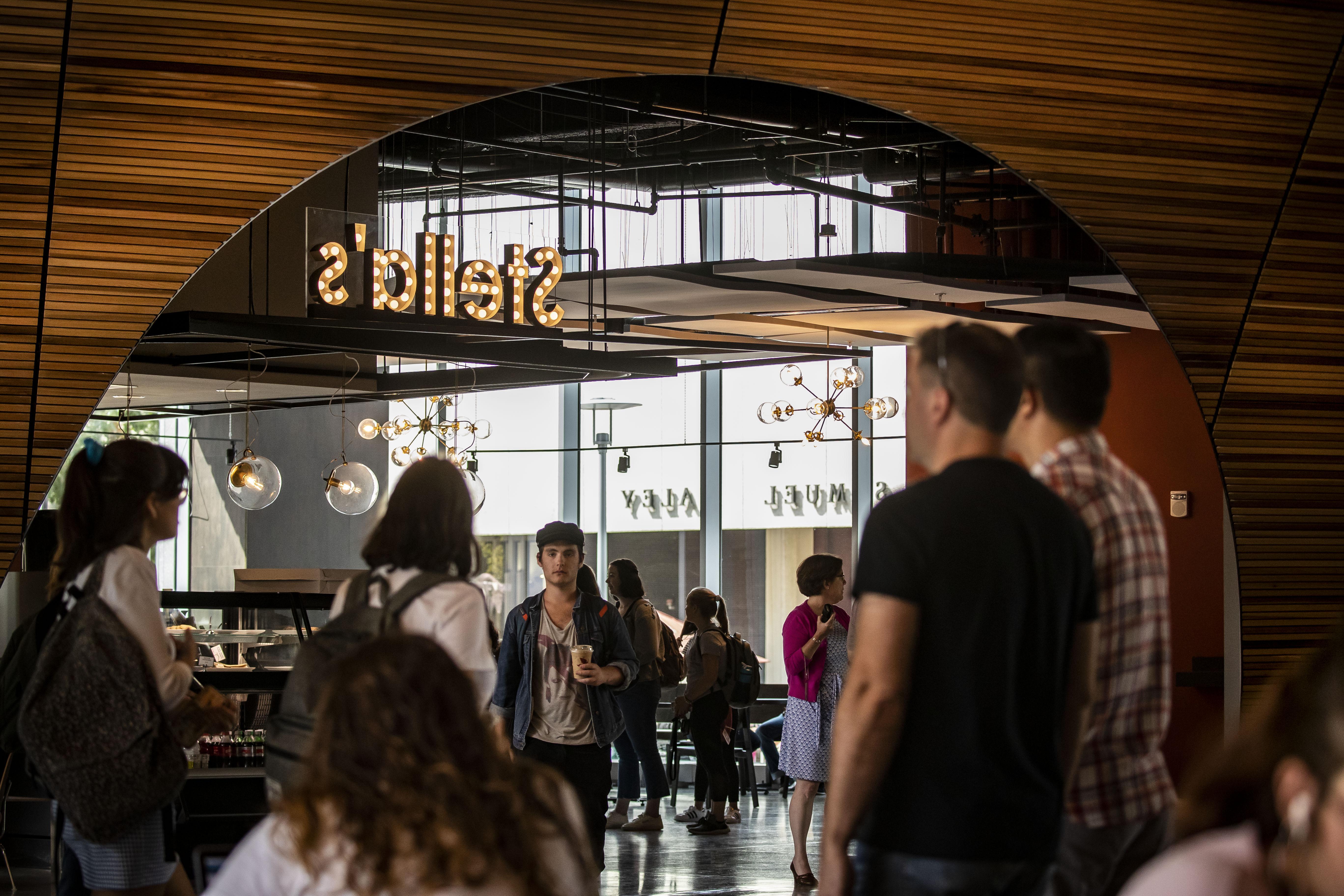 students gathering at Stella's Cafe inside Charles Library