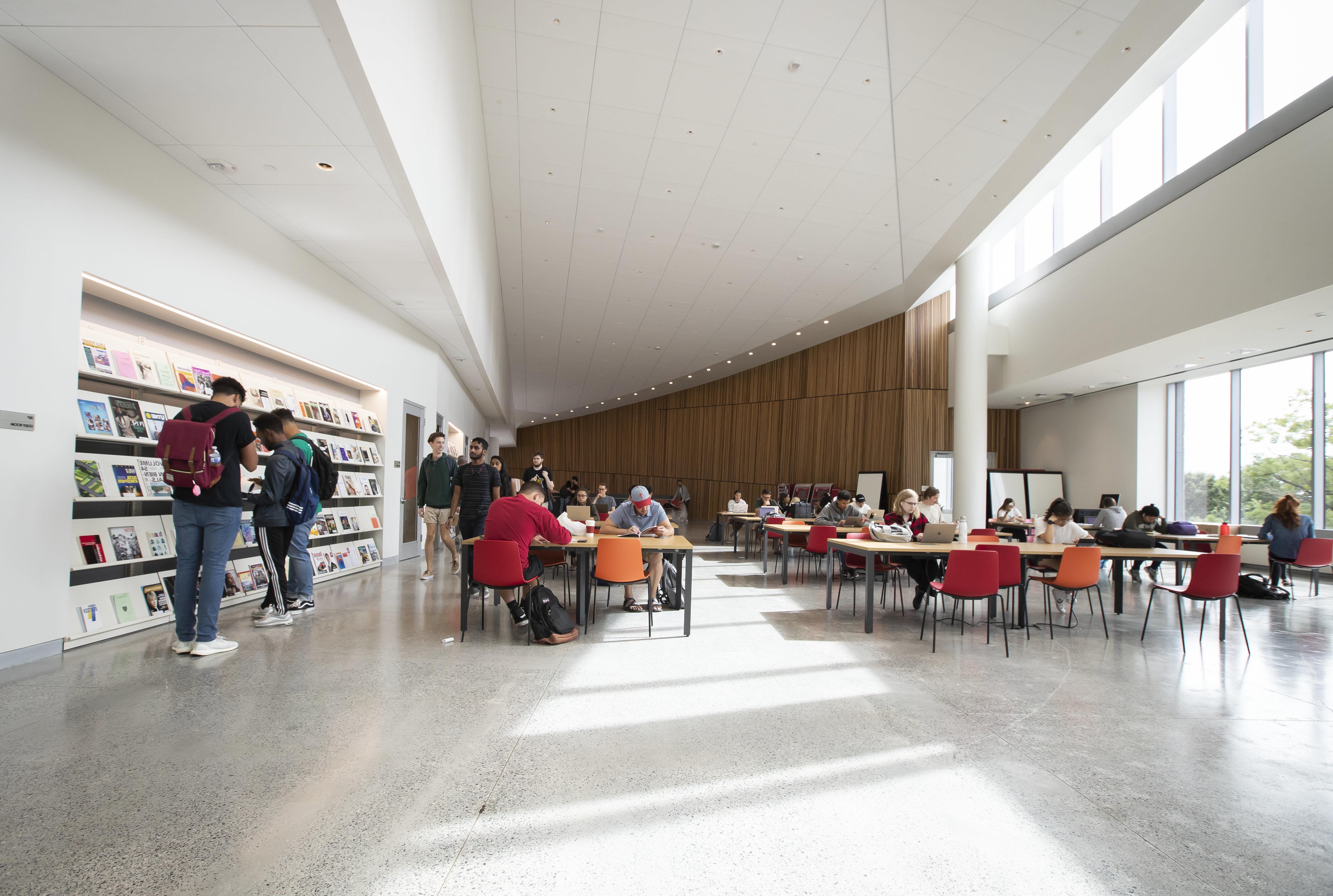 students studying and browsing periodicals in Charles Library