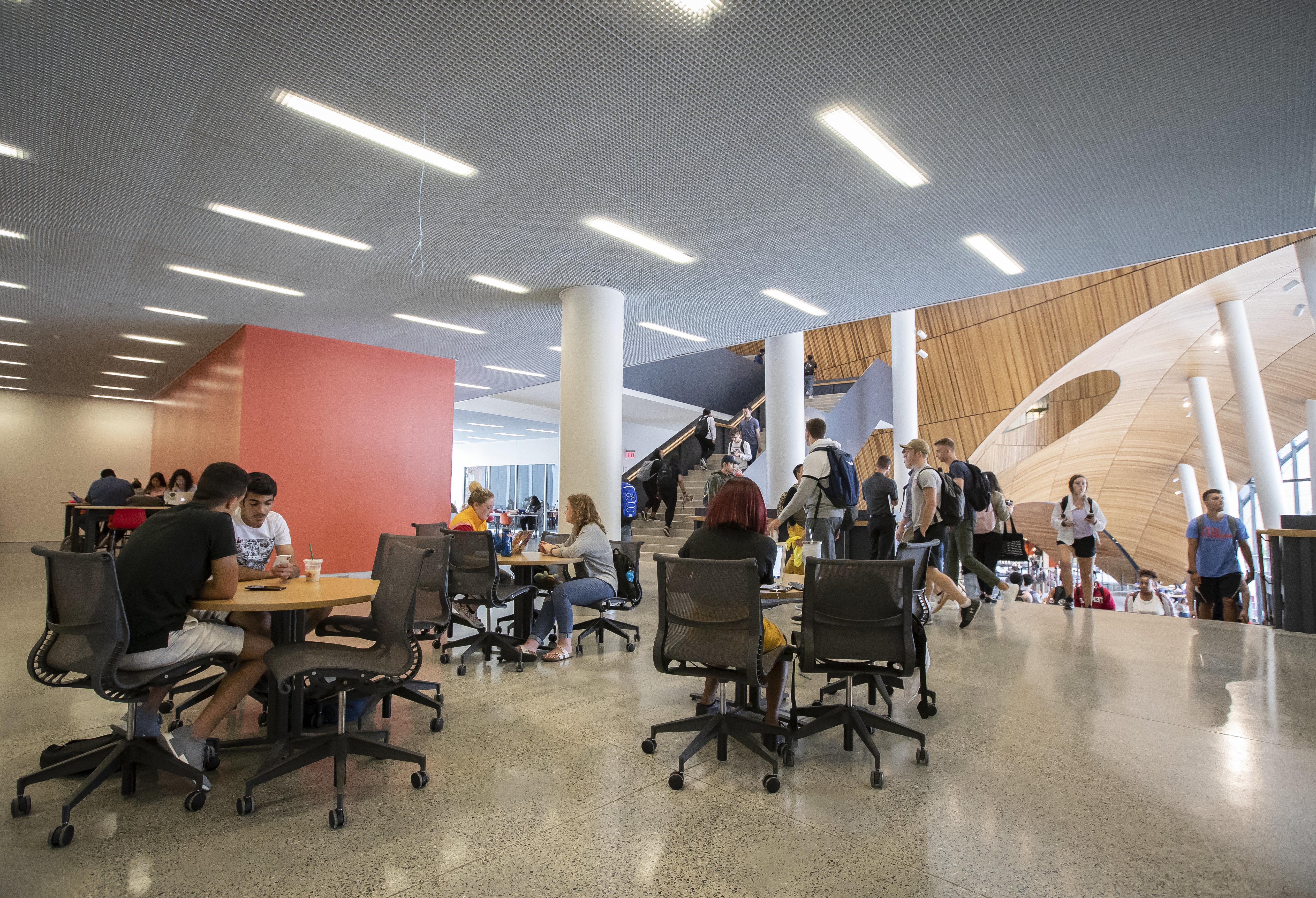 students studying at tables on the second floor of Charles Library